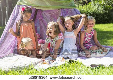 Five girls playing in garden teepee View Large Photo Image Picture - Five girls playing in garden teepee. Fotosearch