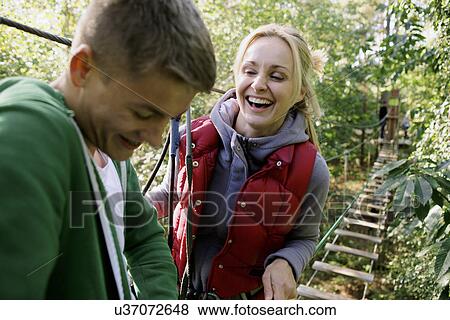 Friends having a fun day out in the woods View Large Photo Image Stock Photo - Friends having a fun day out in the woods. Fotosearch