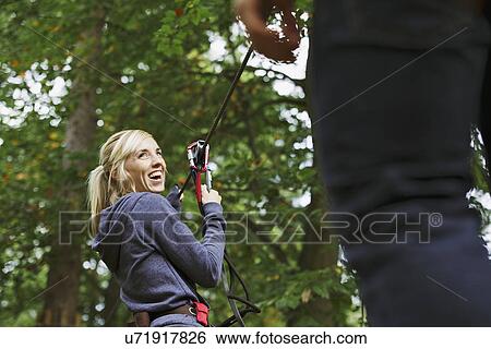 Stock Photograph - Friends having a fun day out in the woods. Fotosearch