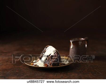 Stock Photo - Fruit cake with brandy and armagnac sauce. Fotosearch
