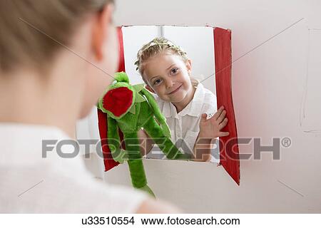 Girl doing puppet show View Large Photo Image Picture - Girl doing puppet show. Fotosearch
