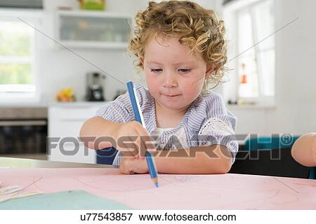 Stock Photo - Girl drawing with pencil. Fotosearch