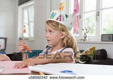 Girl wearing homemade paper crown View Large Photo Image Stock Image - Girl wearing homemade paper crown. Fotosearch