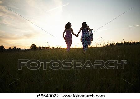 Stock Image - Girls playing on field, Sarsy village, Sverdlovsk region, Russia. Fotosearch