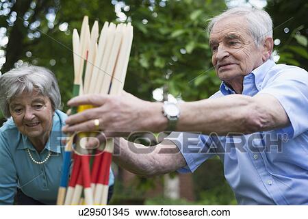 Grandfather and grandmother with giant pick up sticks View Large Photo Image Stock Photography - Grandfather and grandmother with giant pick up sticks. Fotosearch