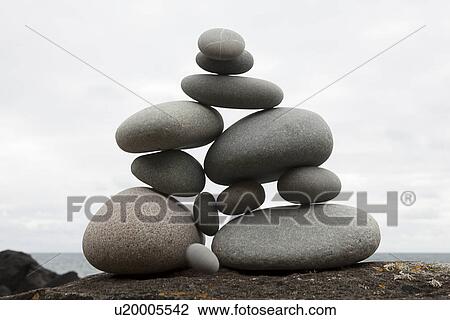 Stock Image - Group of coastal stones balanced on top of each other. Fotosearch