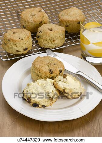 Stock Photo - Homemade scones with butter. Fotosearch