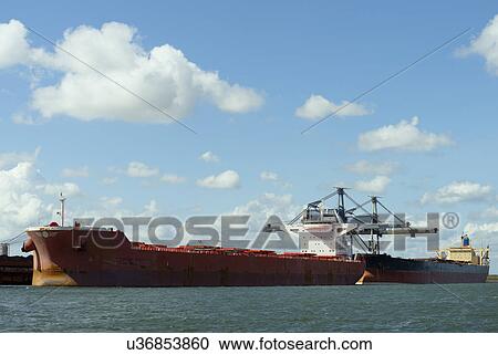 Huge ships moored in the rotterdam harbour, used for transporting coal and iron ore View Large Photo Image Stock Image - Huge ships moored in the rotterdam harbour, used for transporting coal and iron ore. Fotosearch