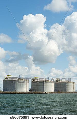 Huge tanks for LNG or liquid natural gas, in the rotterdam harbour View Large Photo Image Stock Image - Huge tanks for LNG or liquid natural gas, in the rotterdam harbour. Fotosearch
