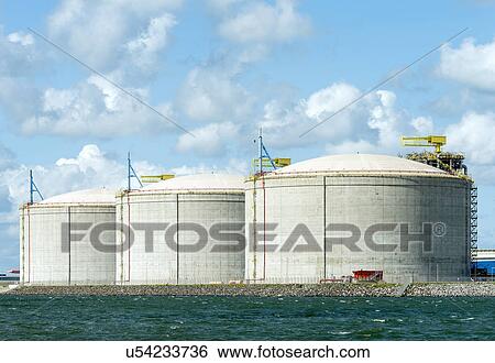 Stock Photograph - Huge tanks for LNG or liquid natural gas, in the rotterdam harbour. Fotosearch