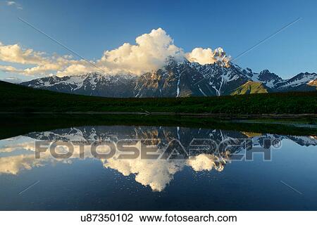 Stock Image - Lake mirror image of Ushba mountain, Mazeri village, Svaneti, Georgia. Fotosearch