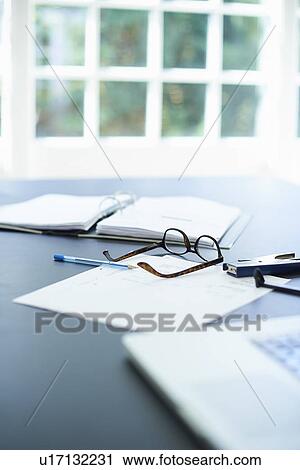 Laptop, eyeglasses and diary on dining room table View Large Photo Image Stock Image - Laptop, eyeglasses and diary on dining room table. Fotosearch