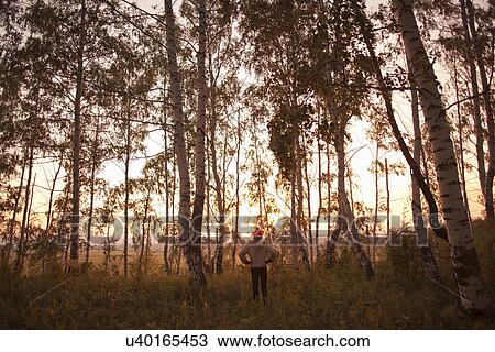 Stock Image - Man in forest, Sarsy village, Sverdlovsk region, Russia. Fotosearch