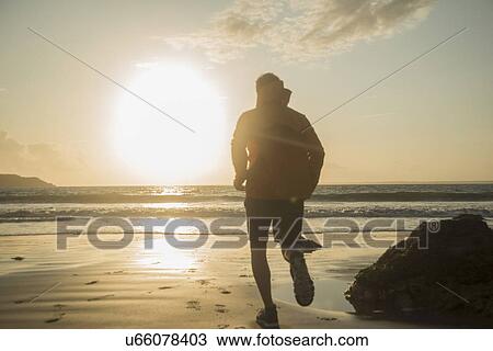 Mature man, running along beach View Large Photo Image Stock Image - Mature man, running along beach. Fotosearch