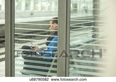 Stock Image - Mature man using cell phone. Fotosearch