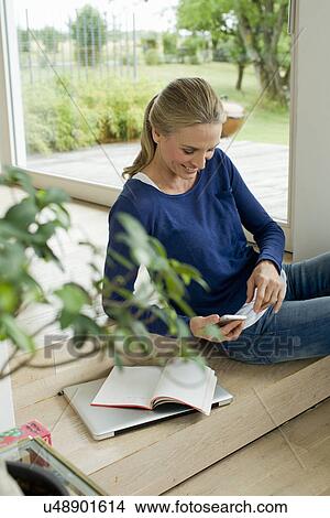 Mature woman using cell phone View Large Photo Image Picture - Mature woman using cell phone. Fotosearch