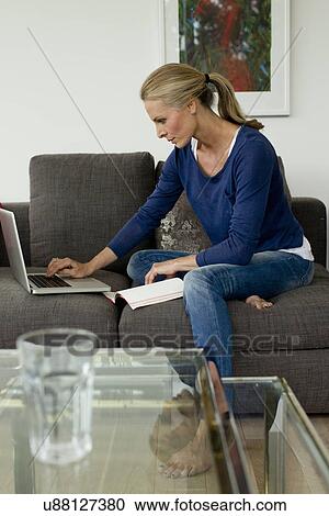 Mature woman working from home on laptop View Large Photo Image Stock Image - Mature woman working from home on laptop. Fotosearch
