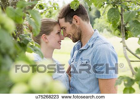 Mid adult couple face to face View Large Photo Image Stock Image - Mid adult couple face to face. Fotosearch
