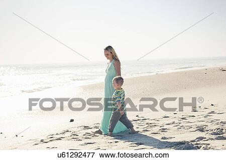Mid adult mother and young son strolling to sea, Cape Town, Western Cape, South Africa View Large Photo Image Stock Photo - Mid adult mother and young son strolling to sea, Cape Town, Western Cape, South Africa. Fotosearch