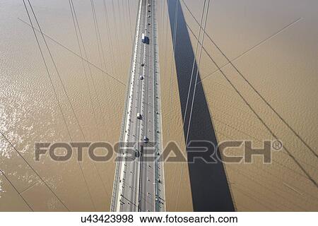 Stock Photo - Overhead view of roadway on suspension bridge. The Humber Bridge, UK was built in 1981 and at the time was the world's largest single-span suspension bridge. Fotosearch