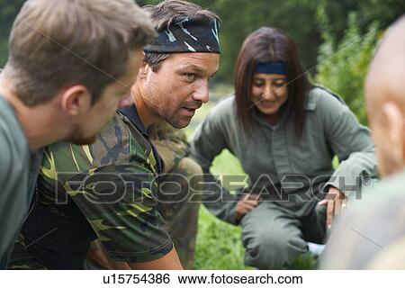 Paintball players preparing and planning game View Large Photo Image Stock Photograph - Paintball players preparing and planning game. Fotosearch