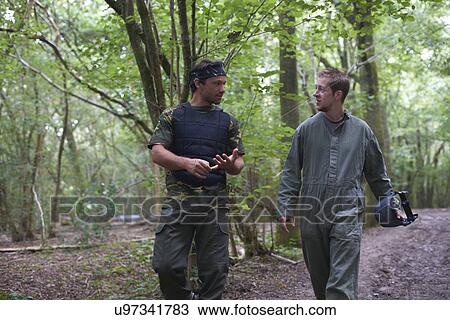 Paintball players walking through forest View Large Photo Image Stock Image - Paintball players walking through forest. Fotosearch