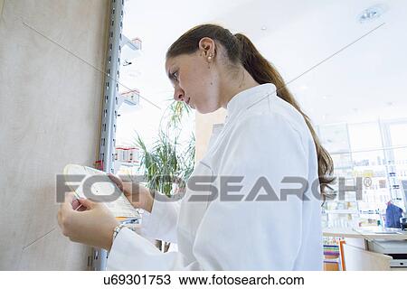 Pharmacist in pharmacy View Large Photo Image Stock Image - Pharmacist in pharmacy. Fotosearch