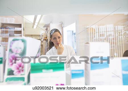 Pharmacist in pharmacy View Large Photo Image Stock Image - Pharmacist in pharmacy. Fotosearch