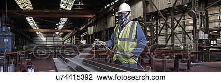 Stock Image - Portrait of a steelworker in his working environment. Fotosearch