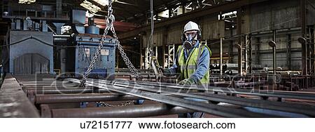 Stock Photo - Portrait of a steelworker in his working environment. Fotosearch