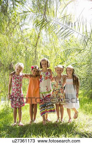 Stock Image - Portrait of five girls in garden. Fotosearch