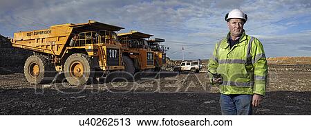 Portrait of foreman with walkie talkie working at quarry View Large Photo Image Stock Image - Portrait of foreman with walkie talkie working at quarry. Fotosearch