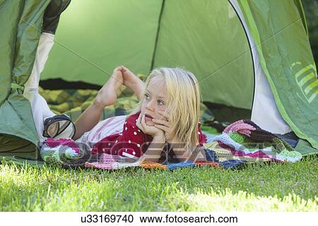 Portrait of girl daydreaming in garden tent View Large Photo Image Stock Image - Portrait of girl daydreaming in garden tent. Fotosearch