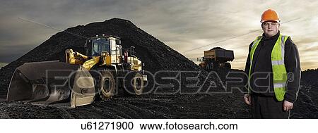 Stock Image - Portrait of mature man working at quarry. Fotosearch