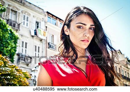 Stock Photography - Portrait of sultry young woman on street, Cagliari, Sardinia, Italy. Fotosearch