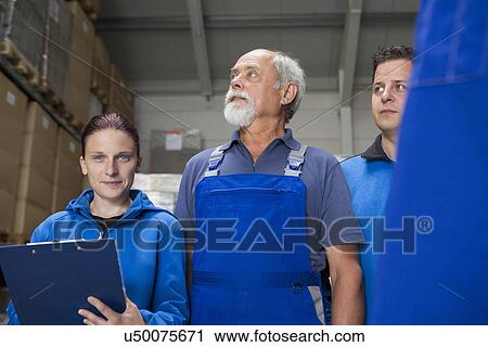 Portrait of team of factory workers View Large Photo Image Stock Image - Portrait of team of factory workers. Fotosearch