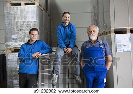 Portrait of team of factory workers View Large Photo Image Stock Image - Portrait of team of factory workers. Fotosearch