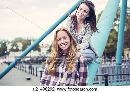 Portrait of two smiling young female best friends View Large Photo Image Stock Image - Portrait of two smiling young female best friends. Fotosearch