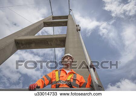 Portrait of worker on suspension bridge. The Humber Bridge, UK was built in 1981 and at the time was the world's largest single-span suspension bridge View Large Photo Image Stock Image - Portrait of worker on suspension bridge. The Humber Bridge, UK was built in 1981 and at the time was the world's largest single-span suspension bridge. Fotosearch