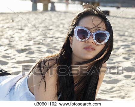 Portrait of young woman on beach in funky sunglasses, Port Melbourne, Melbourne, Victoria, Australia View Large Photo Image Stock Image - Portrait of young woman on beach in funky sunglasses, Port Melbourne, Melbourne, Victoria, Australia. Fotosearch