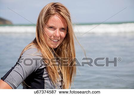 Portrait of young woman wearing wetsuit View Large Photo Image Stock Photo - Portrait of young woman wearing wetsuit. Fotosearch