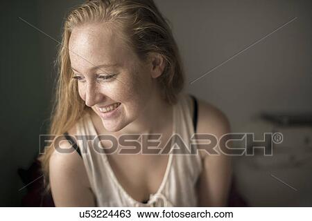 Portrait of young woman with freckles laughing View Large Photo Image Stock Image - Portrait of young woman with freckles laughing. Fotosearch