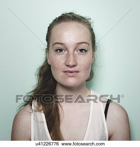 Portrait of young woman with freckles View Large Photo Image Stock Photograph - Portrait of young woman with freckles. Fotosearch