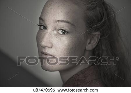Stock Photography - Portrait of young woman with freckles. Fotosearch