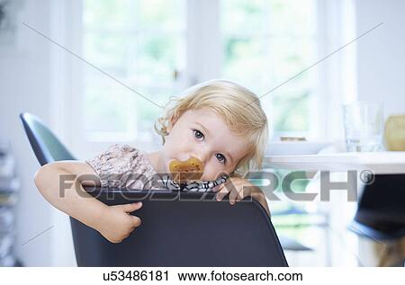 Portrait tired female toddler in living room View Large Photo Image Stock Image - Portrait tired female toddler in living room. Fotosearch