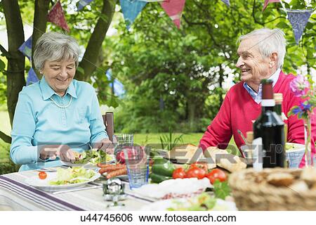 Senior couple eating lunch al fresco View Large Photo Image Stock Photograph - Senior couple eating lunch al fresco. Fotosearch