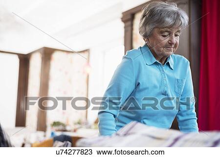 Senior woman wearing blue top View Large Photo Image Stock Image - Senior woman wearing blue top. Fotosearch
