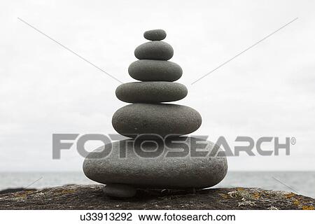 Six coastal stones balanced on top of each other View Large Photo Image Stock Image - Six coastal stones balanced on top of each other. Fotosearch