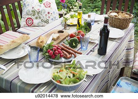Stock Photo - Table set for al fresco meal. Fotosearch