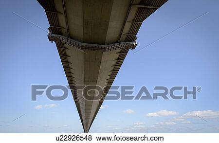 Stock Photo - View of the underside of suspension bridge. The Humber Bridge, UK was built in 1981 and at the time was the world's largest single-span suspension bridge. Fotosearch